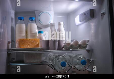Many different dairy products in modern refrigerator Stock Photo