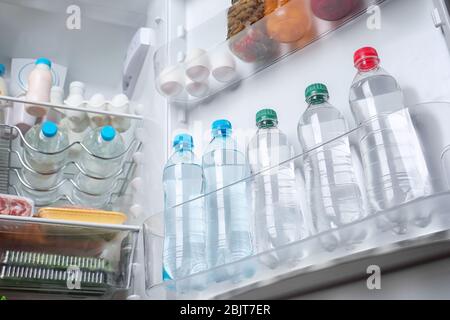 mini fridge full of bottled water isolated on white Stock Photo - Alamy