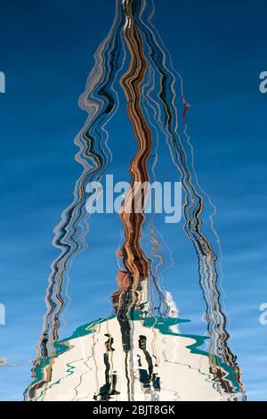 Reflection of a boat in the water at Tromsø harbour, Norway Stock Photo