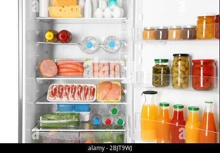 Open refrigerator with fresh products Stock Photo