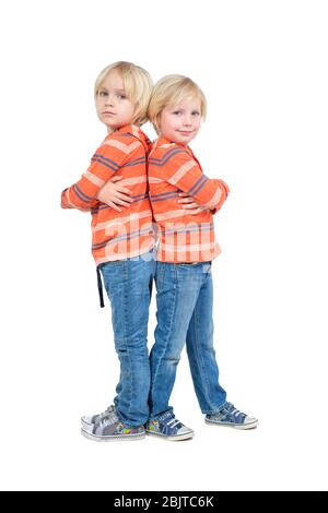 Cheerful handsome young adult twin brothers posing for shooting together  Stock Photo - Alamy