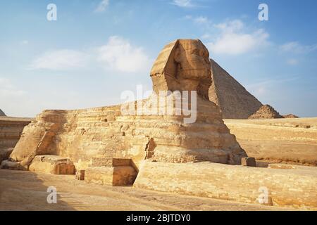 CAIRO, EGYPT - NOVEMBER 19, 2017: View of The Great Sphinx and pyramids on the Giza Plateau - one of the most famous tourist attractions in the world Stock Photo