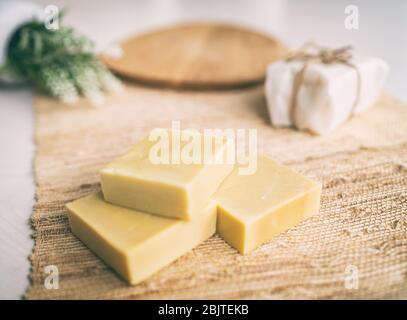 Handmade natural olive oil soap bars DIY homemade soap with lavender essentail oils - activity for what to do inside at home. Top view on decorative background. Stock Photo
