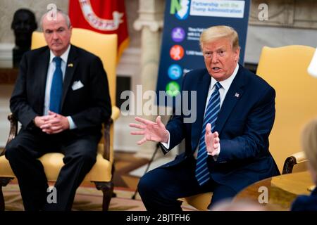 United States President Donald J. Trump makes remarks as he meets with Governor Phil Murphy (Democrat of New Jersey) in the Oval Office of the White House in Washington, DC, Thursday, April 30, 2020. Credit: Doug Mills/Pool via CNP /MediaPunch Stock Photo