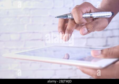 close up of person hand using digital tablet  Stock Photo