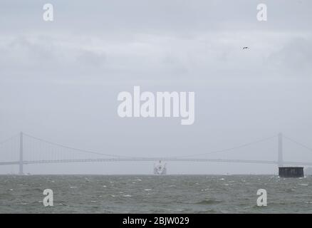 New York, United States. 30th Apr, 2020. The USNS Comfort Navy ship departs from Pier 90 and makes its way under the Verrazzano-Narrows Bridge in New York City on Thursday April 30, 2020. The floating hospital in the form of a Navy ship arrived in New York City at the end of March to relieve pressure on hospitals already overwhelmed with Coronavirus pandemic patients. Photo by John Angelillo/UPI Credit: UPI/Alamy Live News Stock Photo