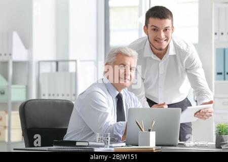 Mature marketing manager with trainee in office Stock Photo