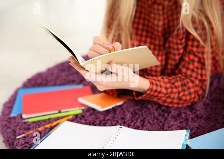Female student preparing for exam indoors Stock Photo