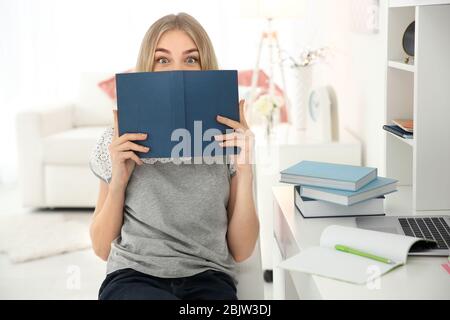 Female student preparing for exam indoors Stock Photo