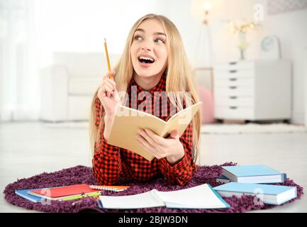Female student preparing for exam indoors Stock Photo