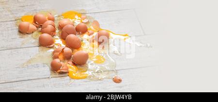 Eggs broken on the  floor background Stock Photo