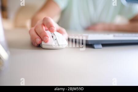 close up hand man using mouse and computer at home Stock Photo