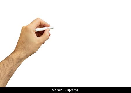 Left hand with a chalk isolated against white background. Left handed man holding a chalk, copy space Stock Photo