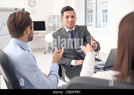 Business trainer giving presentation at management seminar Stock Photo