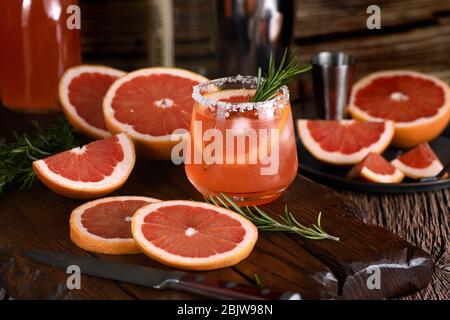 Cocktail tequila fresh grapefruit juice combined and rosemary. A festive drink is ideal for brunch, parties and holidays.