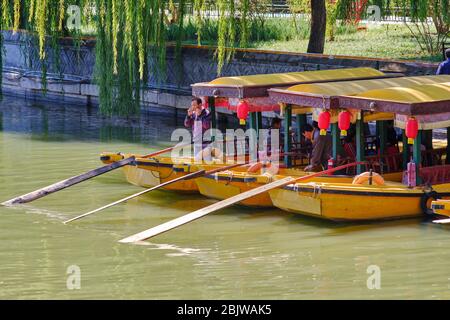 Beijing / China - October 8th 2018: Tourist boats in old imperial gardens of Beihai lake, Beihai park in Beijing Stock Photo