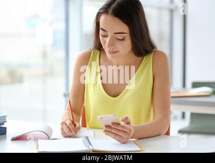 Student preparing for exam in classroom Stock Photo