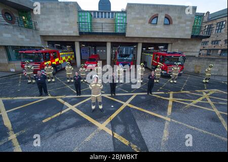 Edinburgh, UK. 30th Apr, 2020. Pictured: Scottish Fire and Rescue Service emergency workers show their appreciation during the 'Clap for Our Carers' campaign - a weekly tribute to thank NHS and key workers during thee coronavirus (COVID-19) outbreak. The public are being encouraged to applaud NHS staff and other key workers from their homes every Thursday at 8pm. To date the Coronavirus (COVID-19) pandemic has infected over 3.21 million people globally, and in the UK infected over 171, 00 and killed 26,711. Credit: Colin Fisher/Alamy Live News Stock Photo