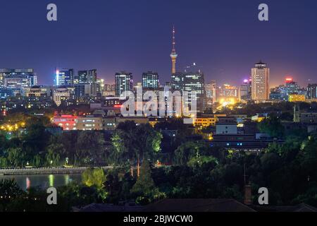 Beijing / China - October 10, 2018: Night view of west Beijing Skyline dominated by the Central Television Tower, view from Jingshan park hill Stock Photo