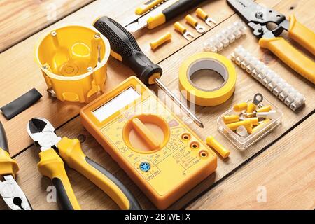 Different electrical tools on wooden background Stock Photo