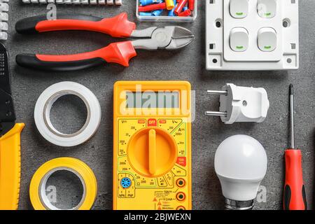 Different electrical tools on grey background Stock Photo