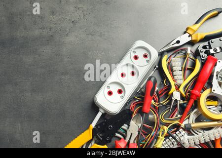 Different electrical tools on grey background Stock Photo