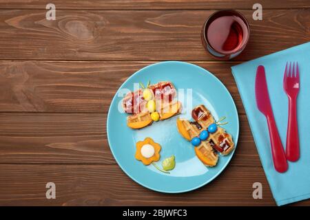 Creative breakfast for children on wooden background, top view Stock Photo