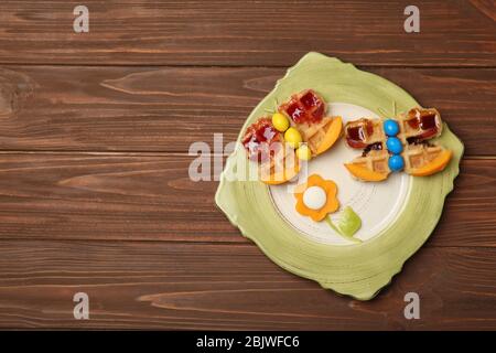 Creative breakfast for children on wooden background, top view Stock Photo