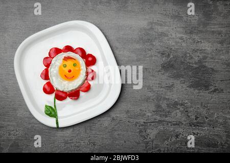 Creative breakfast for children on grey background, top view Stock Photo