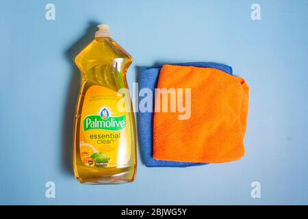 Halifax, Canada- April 11, 2020: A plastic container with yellow Palmolive brand dish washing liquid on blue background Stock Photo