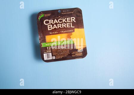 Halifax, Canada - April 11, 2020: A package of re-sealable Cracker Barrel cheese on a blue background Stock Photo