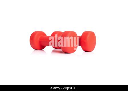 A pair of red dumbbells isolated on white background Stock Photo