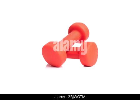 Two red fitness dumbbells isolated on white background Stock Photo