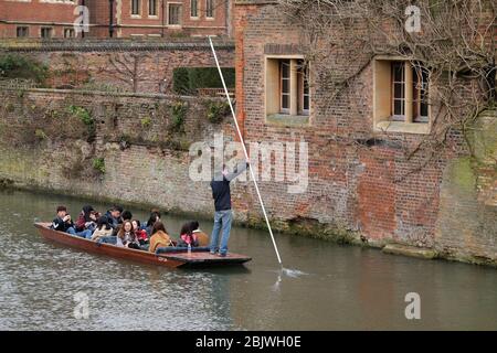 March 2018 - Japanese tourists being taken along  the river cam in a traditional wooden punt.