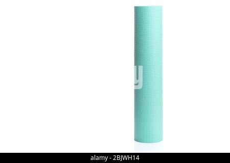 Rolled blue yoga or fitness mat isolated on white background Stock Photo
