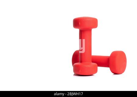 Two plastic coated dumbells for fitness isolated on white background Stock Photo