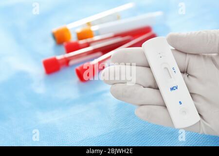 Doctor holding express test for HCV, closeup Stock Photo