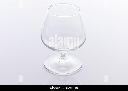 Single empty brandy glass isolated on white background Stock Photo