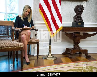 Washington, United States. 30th Apr, 2020. Press Secretary Kayleigh McEnany takes notes as President Donald Trump meets with New Jersey Governor Governor Phil Murphy in the Oval Office of the White House on Thursday, April 30, 2020. Pool Photo by Doug Mills/UPI Credit: UPI/Alamy Live News Stock Photo