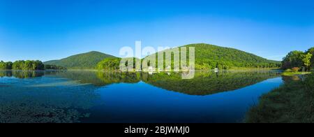 Panorama of Stissing Lake with Stissing Mountain in Pine Plains, NY Stock Photo