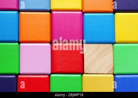 Wooden cubes and one different, closeup Stock Photo