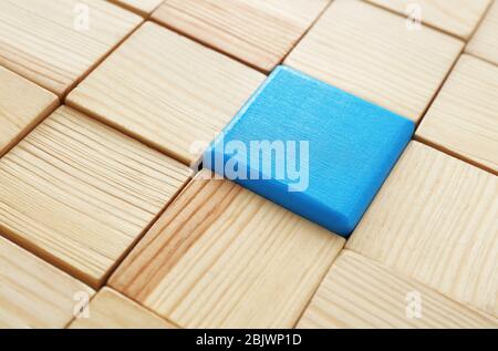 Wooden cubes and one different, closeup Stock Photo