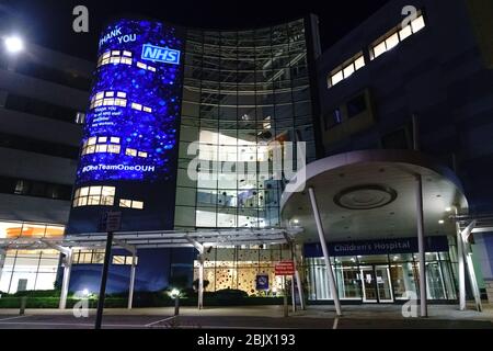 April 30th 2020. The John Radclifffe Hospital, Oxford, Oxfordshire, UK.  An illuminated message of thanks to the NHS, other key workers, and the general public, for their dedication and compliance during the coronavirus pandemic, was projected onto the West Wing building at The John Radcliffe Hospital. Thank you NHS. Credit: Bridget Catterall/Alamy Live News. Stock Photo