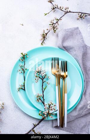Spring table setting with blooming branch Stock Photo