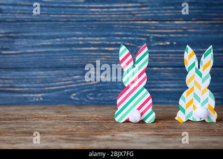 Easter bunnies made from patterned paper on table Stock Photo