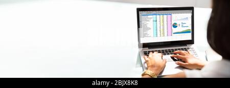 Spreadsheet On Laptop. Person Working With Electronic Computer Spreadsheets Stock Photo