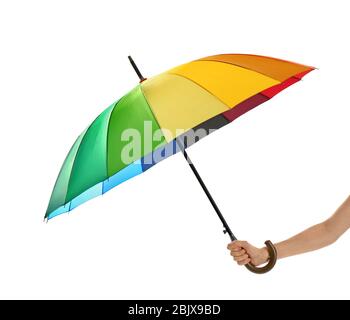 Woman holding rainbow umbrella on white background Stock Photo