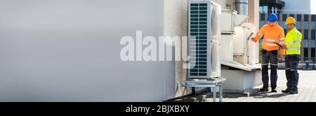 Air Conditioning Inspection Maintenance And Repair By Technicians Stock Photo