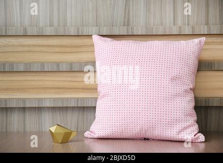 Stylish soft pillow on table Stock Photo