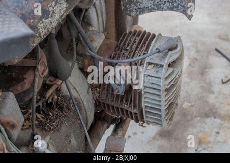 The head of an old retro bike with an opposing engine, rusty metal on a motorcycle. Stock Photo